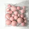 Detailed view of pink decorative cake topper balls in various sizes with wire stems - 20pcs (4 Sizes) / Pink