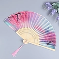 Folding fan with pink cherry blossoms and matching tassel on a bamboo frame - Purple Pink Cherry Dream