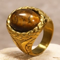 Macro shot of men's gold stainless steel ring with oval tiger eye stone and braided detail - US 7 / Gold Tiger's Eye