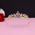 Close-up of golden bridal crown featuring purple teardrop crystals and white rhinestones - No.12 KC Gold (Purple Stone)