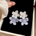 Close-up of elegant blue and white flower stud earrings with silver needles in a jewelry box - 72# White Purple Enamel Rhinestone Petal Studs