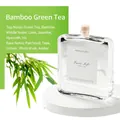 Bamboo and Green Tea reed diffuser in square glass bottle on white display stand - Bamboo Green Tea