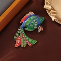 Colorful fish brooch with enamel finish and sparkling crystals on silk background - Goldfish