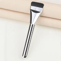 Macro detail of slim flat foundation brush with dense bristles and silver metal handle - Silver