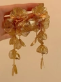Macro shot of gold bridal flower earrings with long tassels and intricate metal petals - Gold Hollow Flower Tassel (1#)