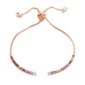 Adjustable rose gold bolo bracelet featuring a gradient of colorful rainbow gemstones - Bracelet: 57