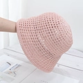 Close-up of pink crochet straw bucket hat with intricate hollow-out breathable design - Adjustable / Pink
