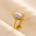 Detail of gold open ring with twisted texture and white oval marble-style stone inlay - Adjustable Open / Gold-White