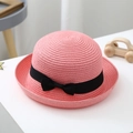 Pink woven straw sun hat for girls featuring a classic black decorative ribbon bow - S (52-54cm) / Dusty Pink