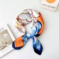Blue and orange block print silk square scarf tied in a stylish knot for women - White Magnolia with Navy Border