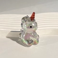 Macro shot of iridescent unicorn acrylic pendant with vibrant colorful UV plating finish - Magic Black