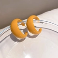 Close-up of glossy yellow acrylic C-shaped earrings on glass with natural lighting - 9# Silver Pin - Ginger Yellow - Glossy C-Shape