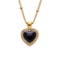 Detail of a gold heart pendant with black center and sparkling crystal rhinestones - Black Heart with Diamonds