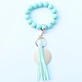 Beaded keychain bracelet with mint green wooden beads, leather tassel and metal clasp - Mint Green