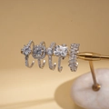 Detail of five silver rings featuring zircon stones in square and round cuts - Five-Piece Set / Silver