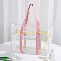 Transparente PVC-Reisetasche mit rosa Griffen, gelbem Reißverschluss und Sternmuster - Rosa