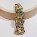 Macro shot of gold Santa Muerte pendant with colorful cubic zirconia and sickle detail - Style B Multi-color