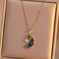 Golden moon and star necklace with abalone shell inlay on velvet background - Gold Shell Moon and Star Necklace