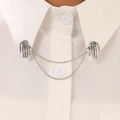 Close-up of gothic silver skeleton hand collar pin with double chains on white shirt - Antique Silver Skull Hand Style (N-123)