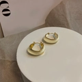 Irregular golden earrings with creamy enamel inlay set on a minimalist white platform - White Geometric Earrings