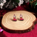 Cute Christmas boot stud earrings for women on a festive wooden display stand - Christmas Boot