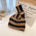 Knit knot wrist bag featuring classic black and tan horizontal stripes in soft texture - Black and Coffee Striped