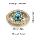 Macro detail of gold evil eye pendant with blue resin and cubic zirconia stones - YSN034-09 (Blue Glaze Gold Edge)