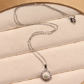 Close-up of elegant freshwater pearl necklace with zircon inlay in a velvet box - Necklace