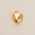 Close-up of heart-shaped gold locket with polished finish and functional side hinge - Heart Locket Pendant