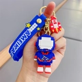 Blauer verpixelter Astronauten-Schlüsselanhänger mit Raketenanhänger und Silikonband - Pixel Astronaut--Blau