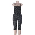 Detailed close-up of sexy black lace jumpsuit featuring hollowed fabric and slim-fit texture - XS / Black