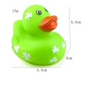 Detail of green rubber duck toy with shamrock patterns and 5.5cm size markings - Green Clover Duck