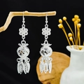 Vintage silver Bohemian floral earrings with hollow spheres and leaf tassels on wood - Petal Hollow Ball Leaf Tassel Style (E6109-33)