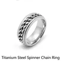 Detail of silver titanium steel spinner ring with rotatable cuban chain inlay - 8mm Embossed Chain Ring - Silver / Size 8