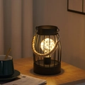 Detail of black iron lantern with jute handle and warm LED lights on wood table - Vertical Stripe Handheld Lantern / Warm Light-Battery Type