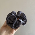Handheld dark grey satin scrunchie with French vintage ruffles and silky texture - Gray