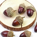 Artificial reddish-brown acorns with textured caps and bronze rings for DIY decor - Acorn Charms With Metal Loop
