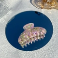 Detail of large acetate hair claw clip with colorful pink and purple marble texture - Pink Purple Green Floral