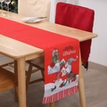Detail of red Christmas table runner with Santa Claus prints and Merry Christmas text - Red Two Rudolphs