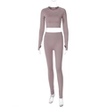 Detail view of pink long sleeve crop top and high waist yoga pants in knit texture - S / Nude