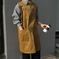 Brown canvas work apron with multiple pockets for professional kitchen and studio use - Crew Neck Pullover Apron / Orange
