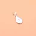 Close-up of 925 sterling silver water-drop pendant with engraved hexagram star pattern - Water Drop Silver