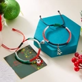Braccialetti natalizi magnetici per coppie con ciondoli Babbo Natale e albero - Babbo Natale e Albero - Rosso Verde Nero Bianco