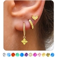 Detailed view of gold plated earrings set with yellow stones and a colorful gem chart - November Topaz
