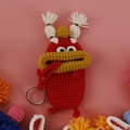 Handmade red crochet sausage mouth monster key case with cute big eyes and silver ring - Red