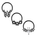 Detailed macro view of black nose rings with butterfly, flower, and bat zircon designs - 1.2x8mm / Black Wings Floral Bat Style (Set 16)