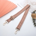 Detail of adjustable woven canvas strap with gold metal hooks and herringbone pattern - Brown/White Classic Chevron