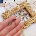 Detailed close-up of butterfly stud earring with colorful aurora finish and screw back - Screw Ball Stud Single / Iridescent Black Butterfly