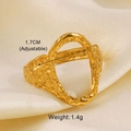 Detail view of gold adjustable oval ring with hammered texture on silk fabric - Irregular Hammered Style