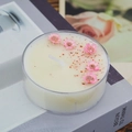 Handmade scented tea light candle with pink dried flowers in a clear round holder - Cherry Blossom